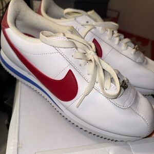 Nike White Sneakers with Red Swoosh and Blue Sole Trim